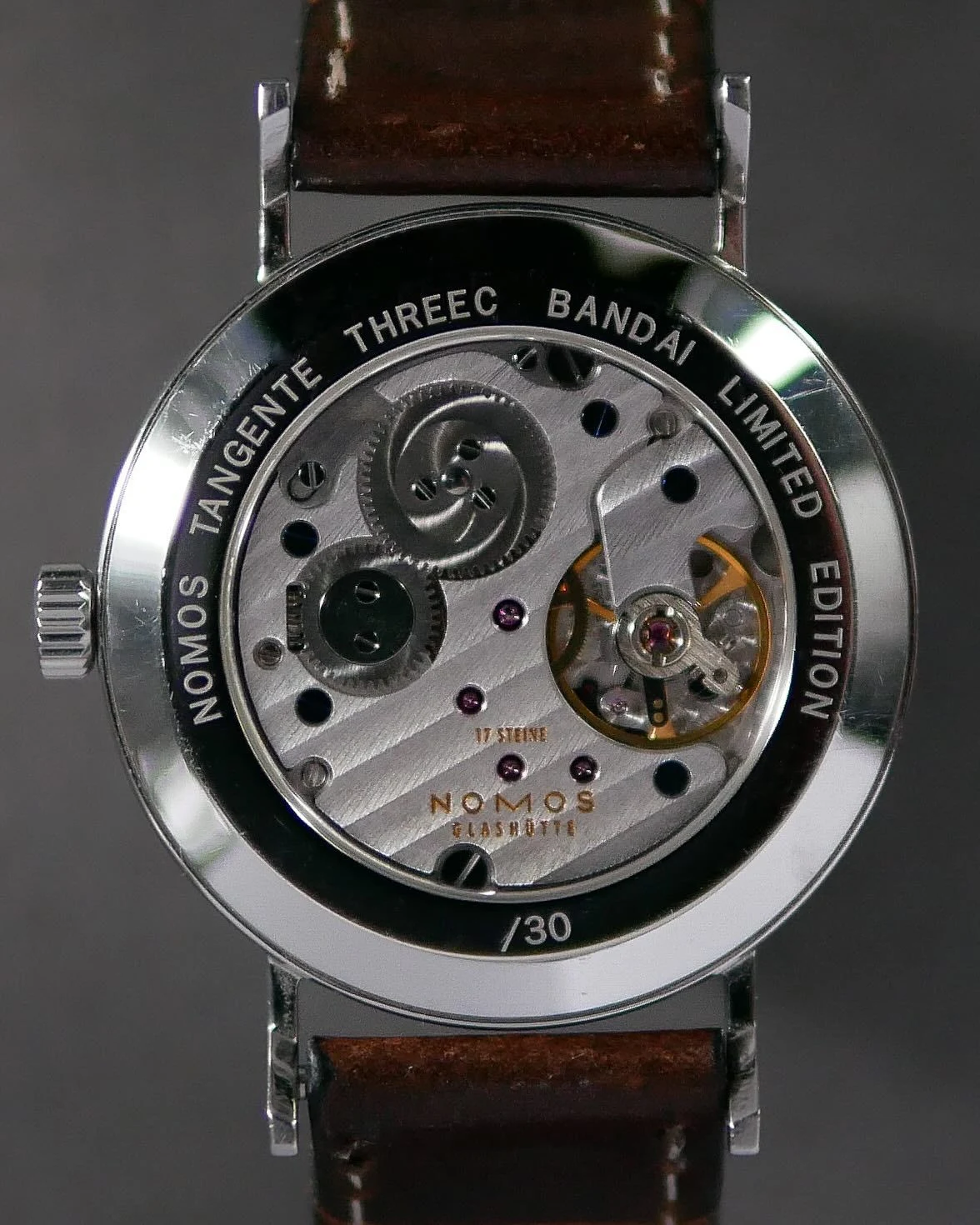 Caseback of the Tangente Power Reserve Threec Bandai